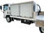 Lawn care spray truck carrying a ride-on spreader sprayer